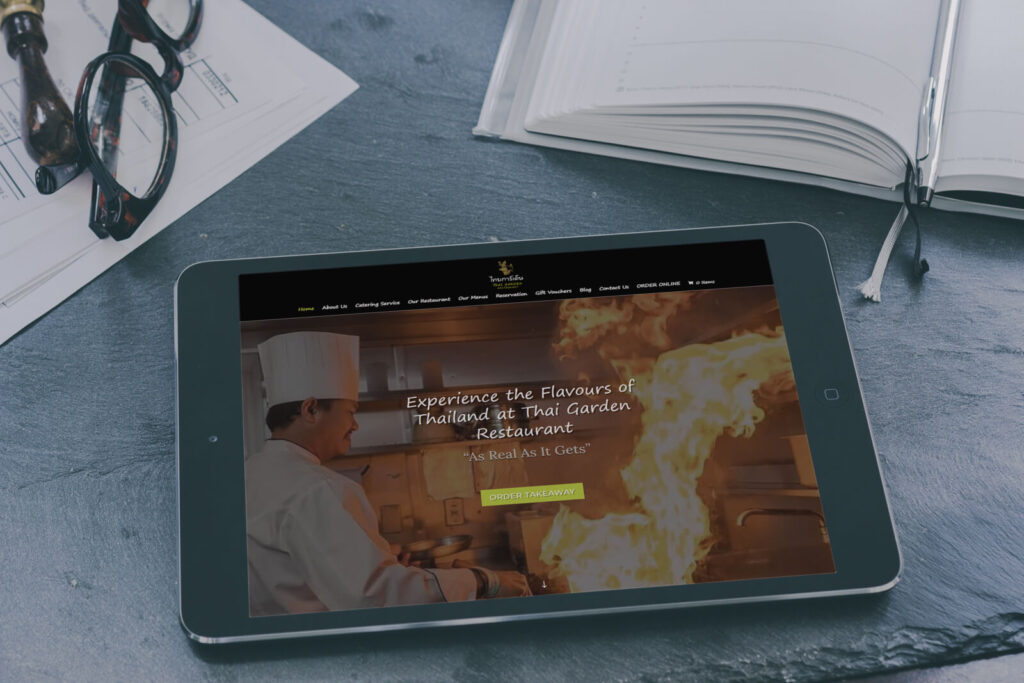 Restaurant website design displayed on a tablet screen