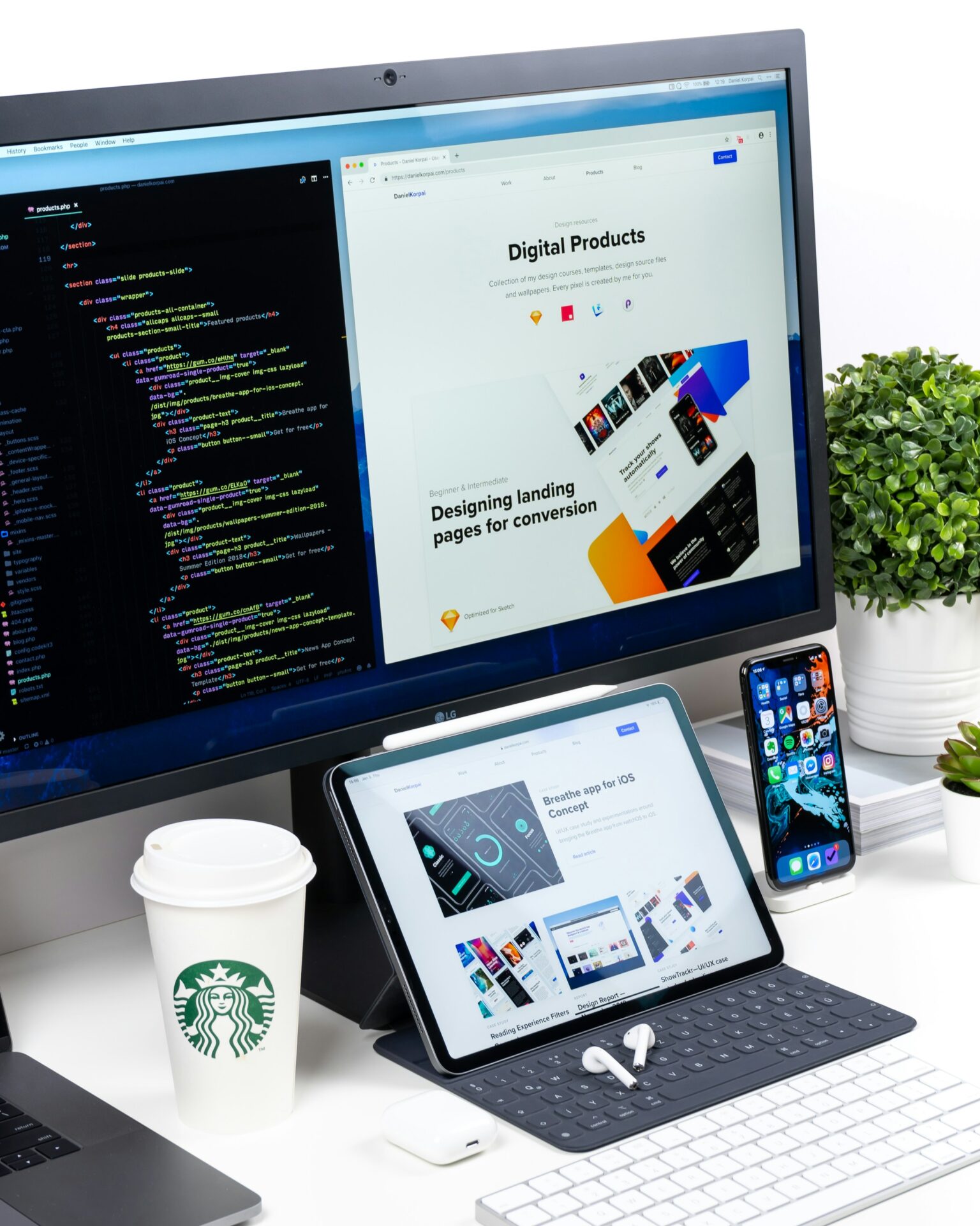 Desk setup with laptop, tablet and digital design tools