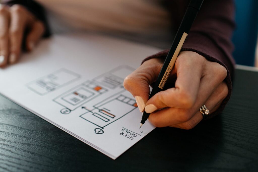 Planning a brochure website layout with hand-drawn wireframes