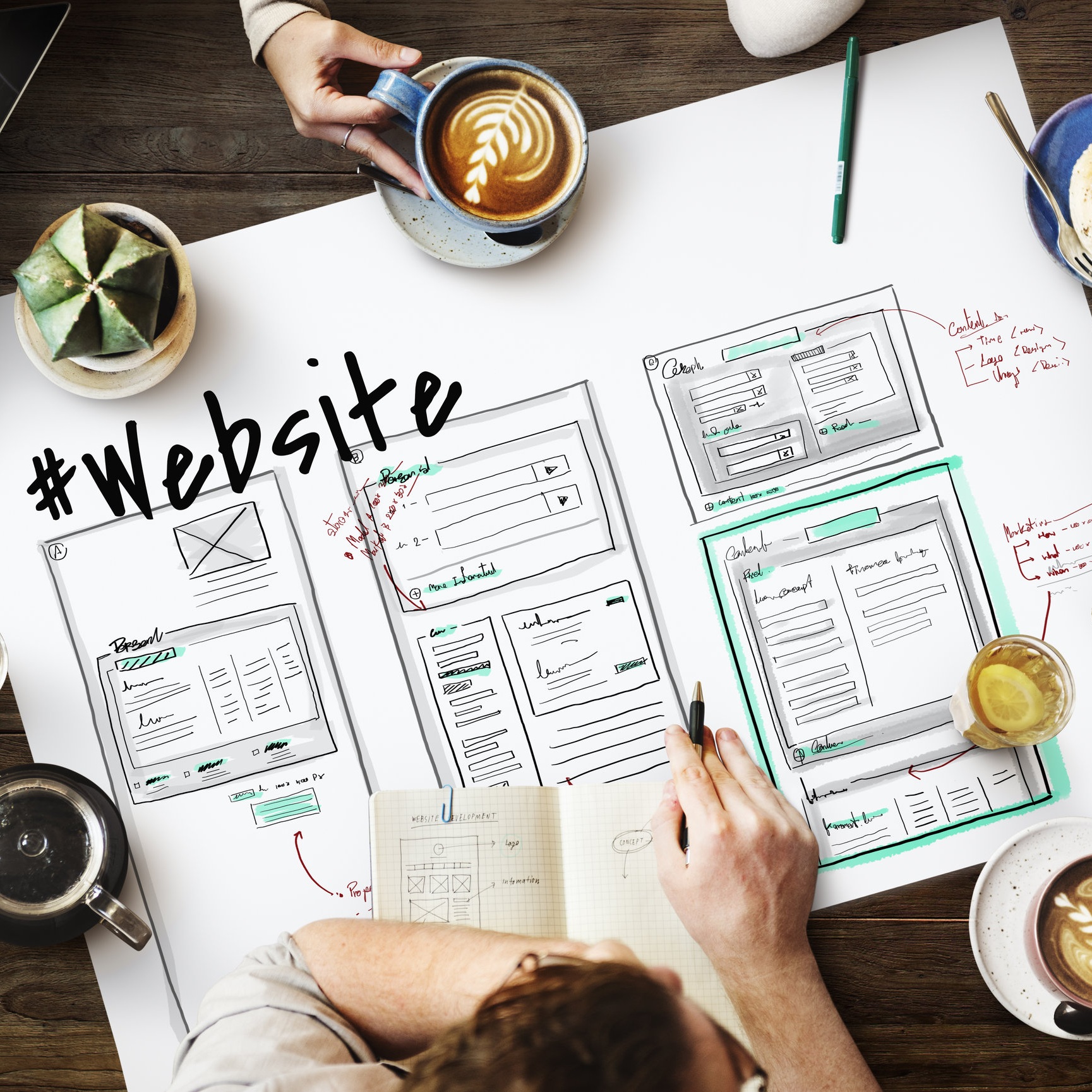 Website wireframes and page layouts sketched during web design planning